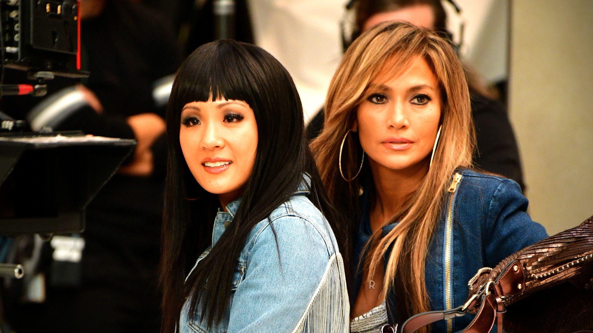Constance Wu and Jennifer Lopez filming a scene from Hustlers in New York CIty.