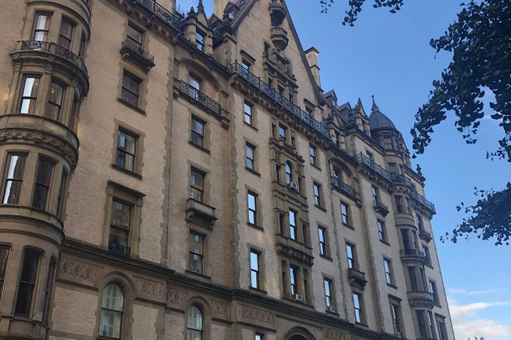 a large building with The Dakota in the background