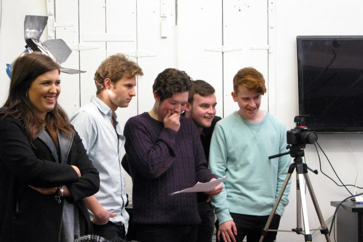 a group of people standing in a room