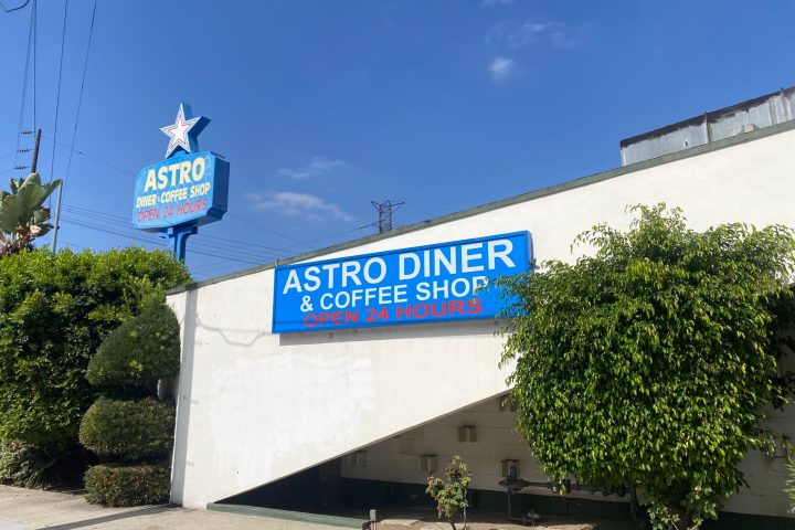 a sign in front of a building