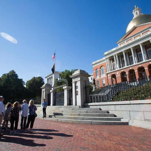 a group of people standing in front of a building